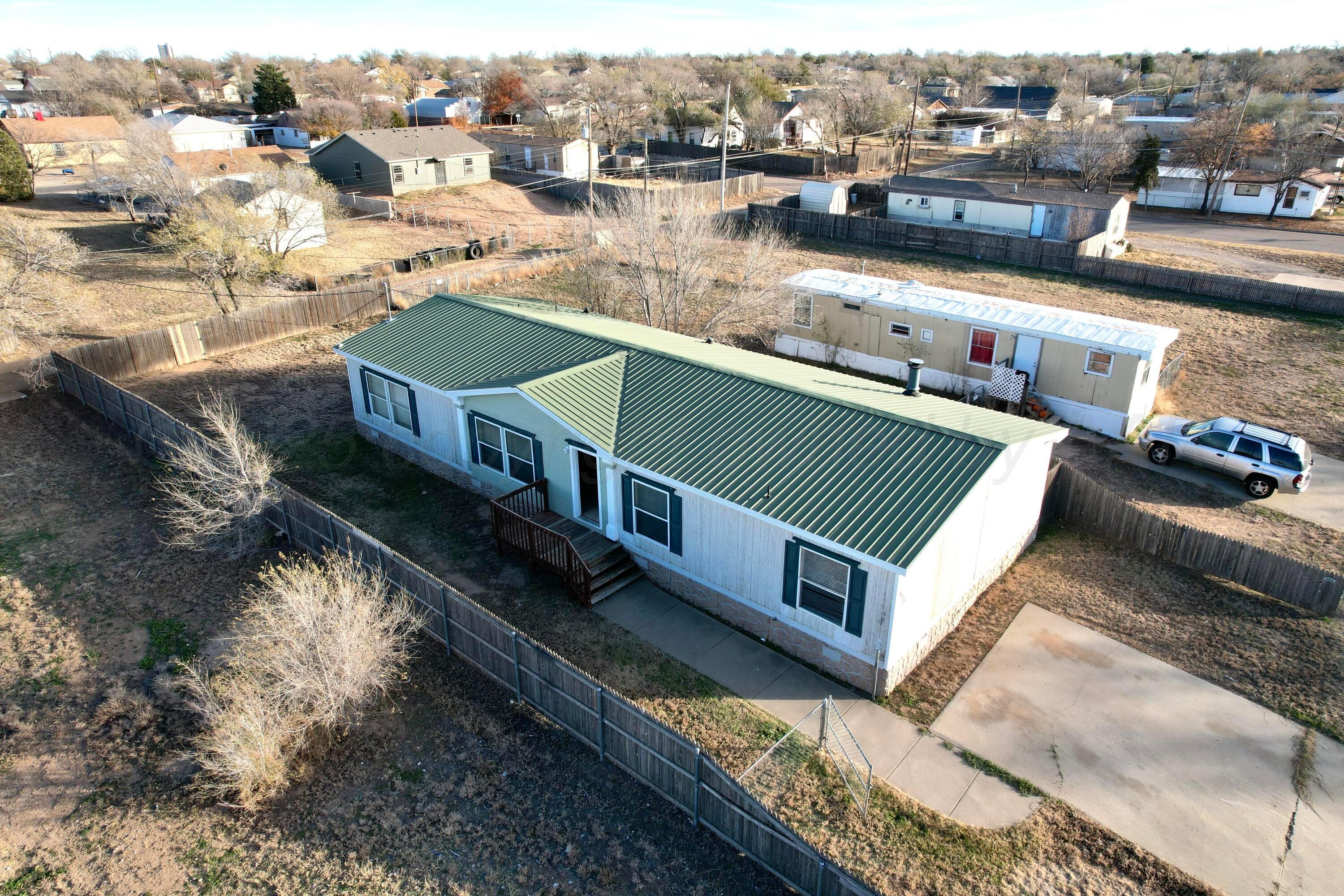406 North Independence Street Amarillo, TX 79106 - Photo 3 of 19 a view of a house with pool and lake view