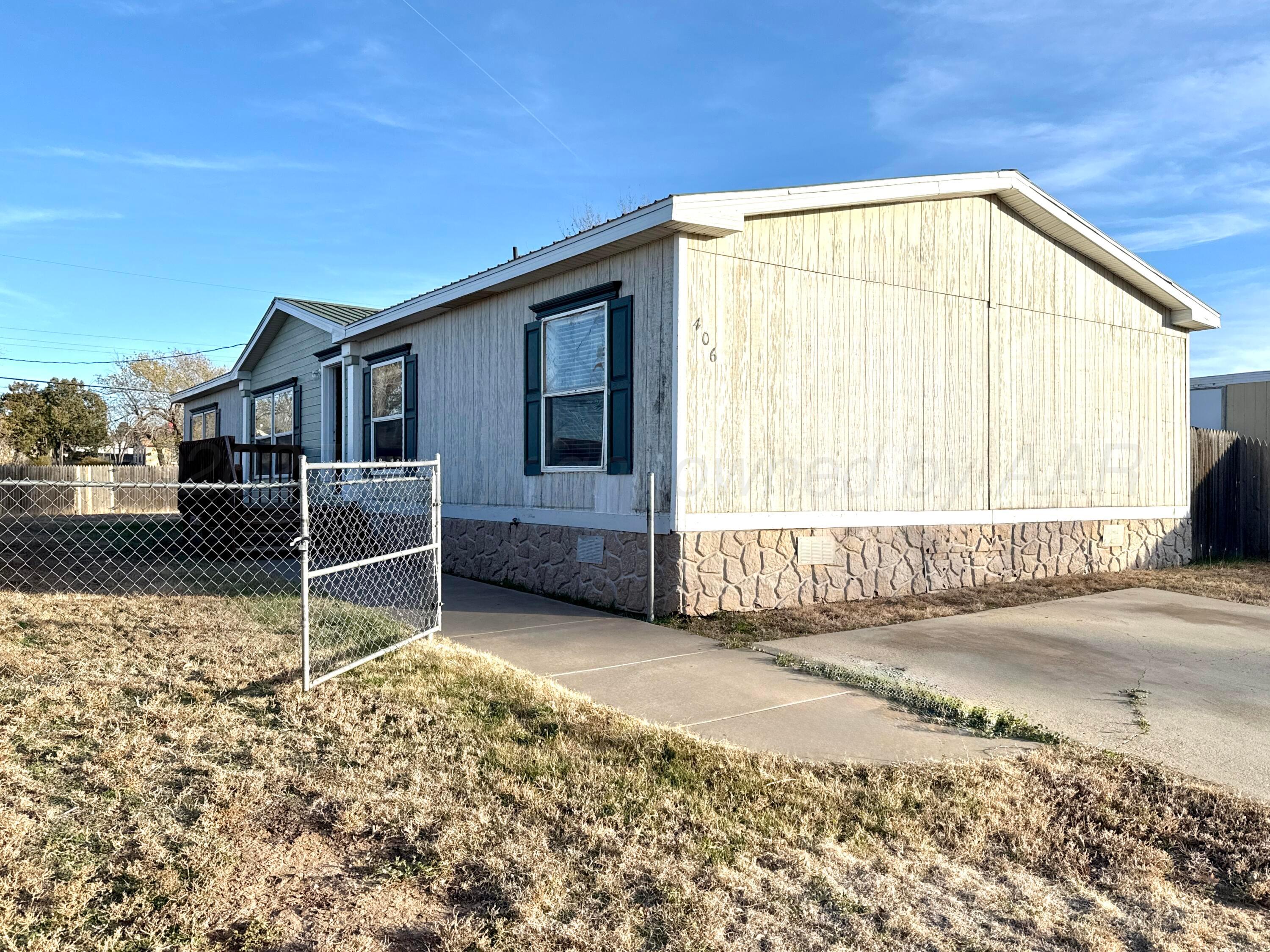 406 North Independence Street Amarillo, TX 79106 - Photo 7 of 19 a view of a house with a yard
