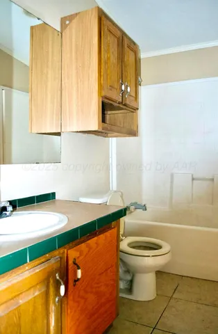 a bathroom with a sink a toilet and a bathtub