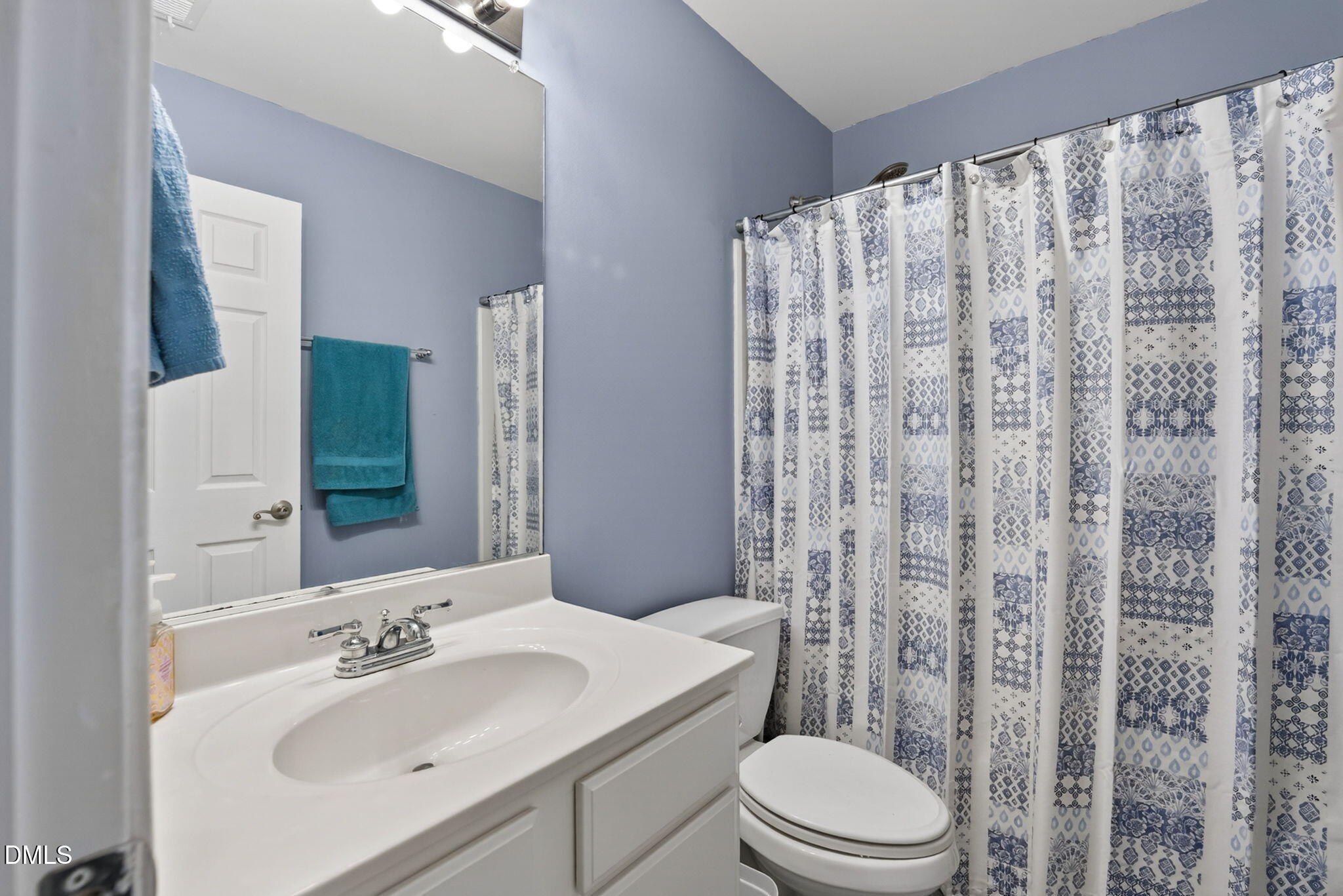 5500 Vista View Court Raleigh, NC 27612 - Photo 31 of 38 a bathroom with a sink toilet and shower