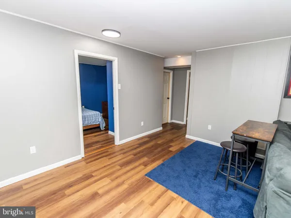 a view of a livingroom with furniture and wooden floor