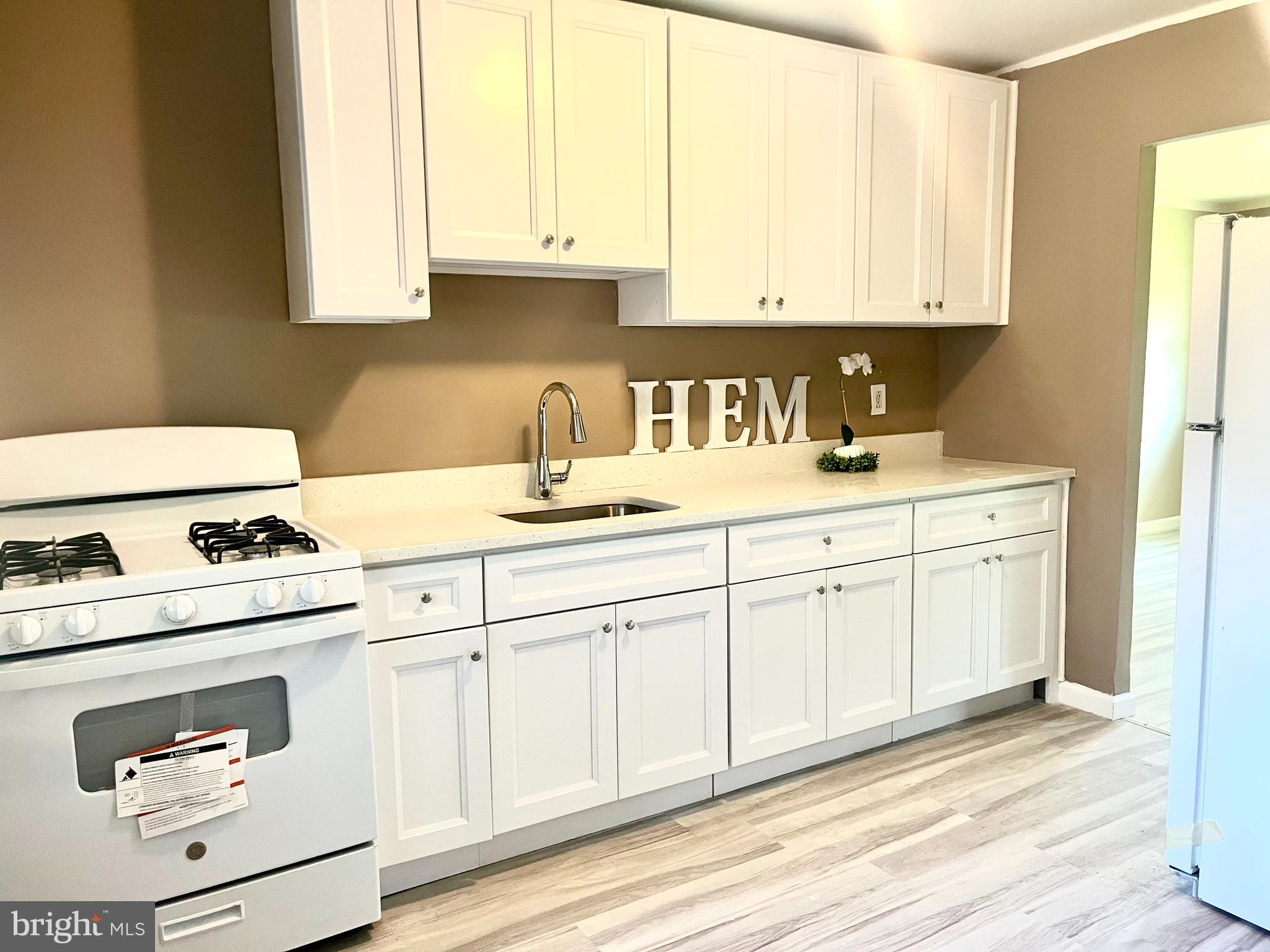 112 Kinsley Road Pemberton, NJ 08068 - Photo 4 of 13 a kitchen with cabinets appliances a sink and a window