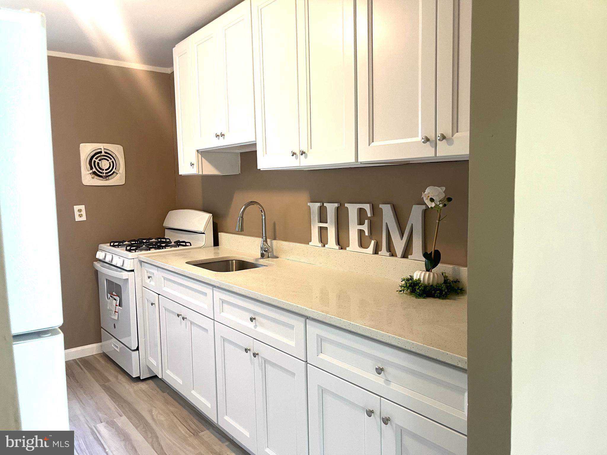 112 Kinsley Road Pemberton, NJ 08068 - Photo 5 of 13 a bathroom with a sink and a mirror