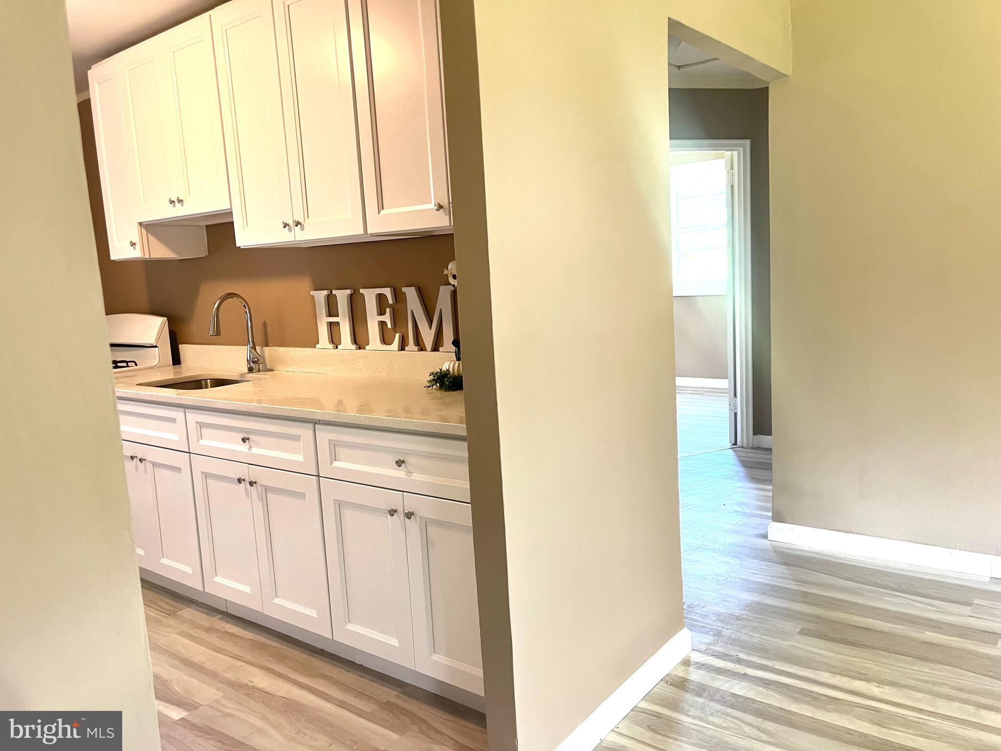 112 Kinsley Road Pemberton, NJ 08068 - Photo 6 of 13 a view of a kitchen with wooden cabinets