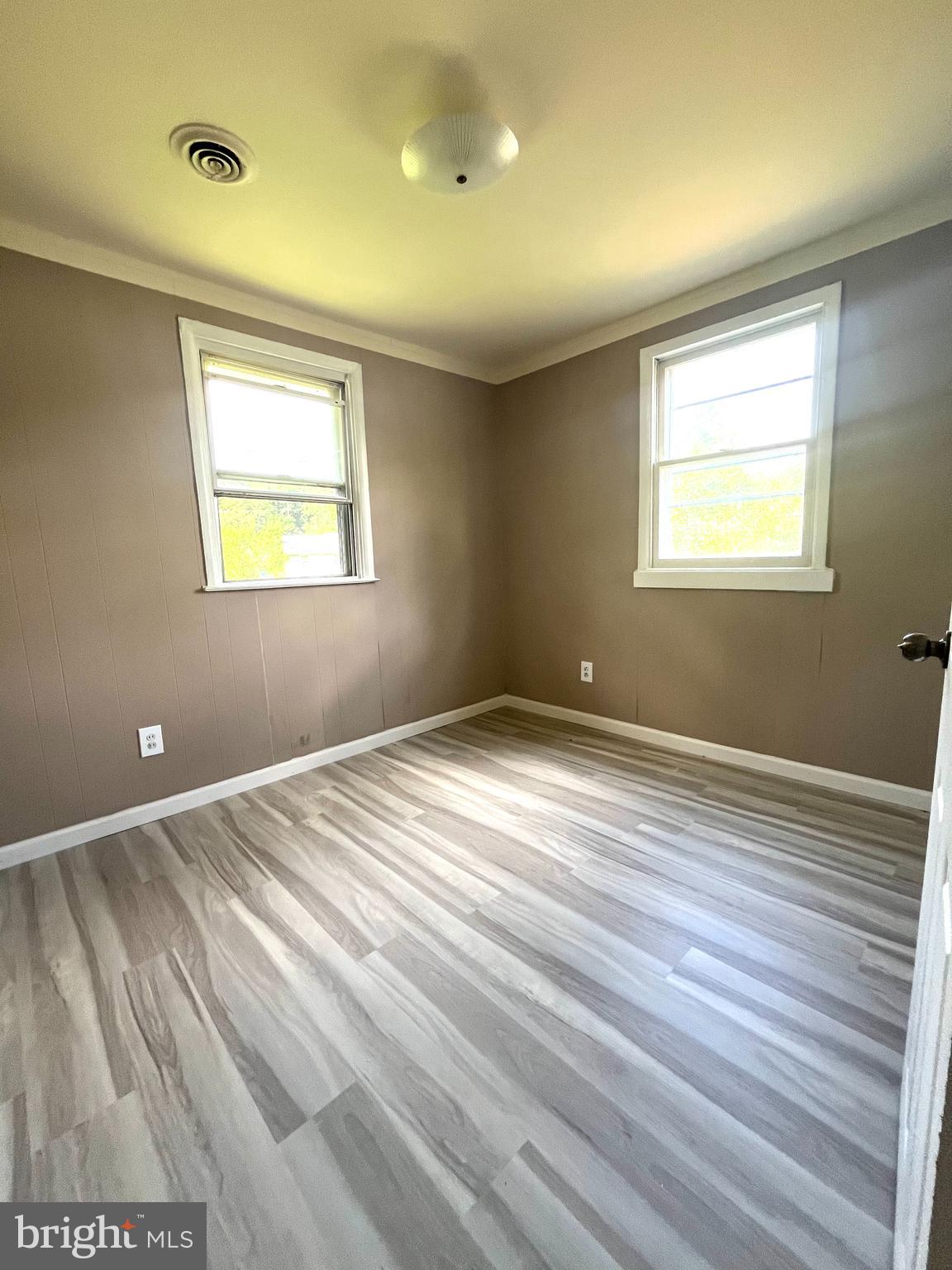 112 Kinsley Road Pemberton, NJ 08068 - Photo 8 of 13 a view of an empty room with wooden floor and a window
