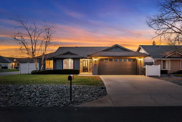 a view of a balcony with chairs and wooden floor