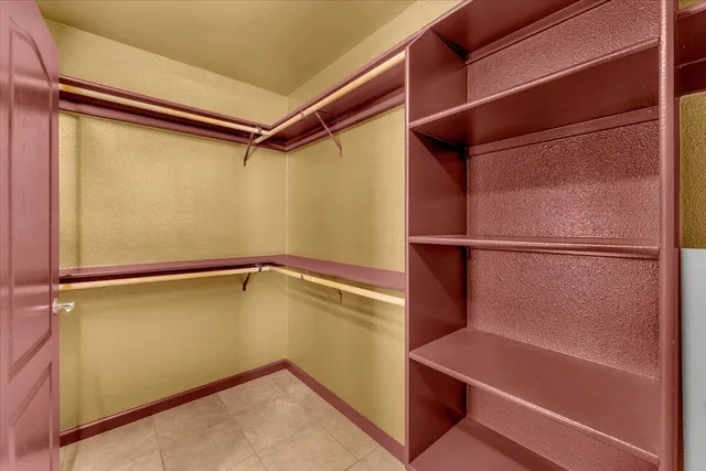 a view of a porch with furniture and garden