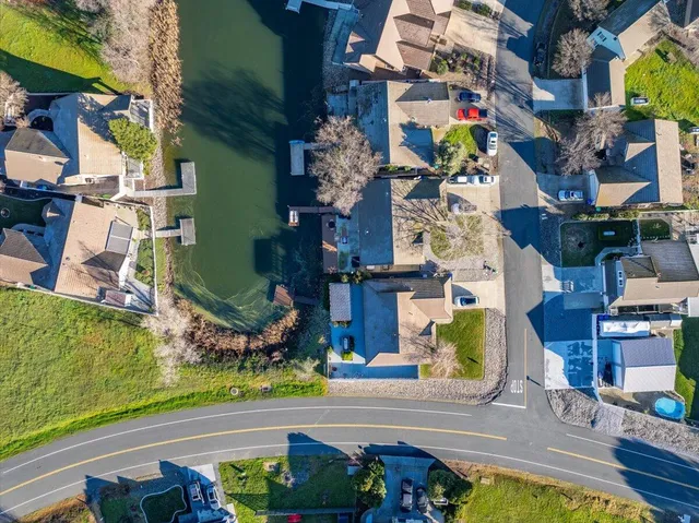 an aerial view of a house with a swimming pool