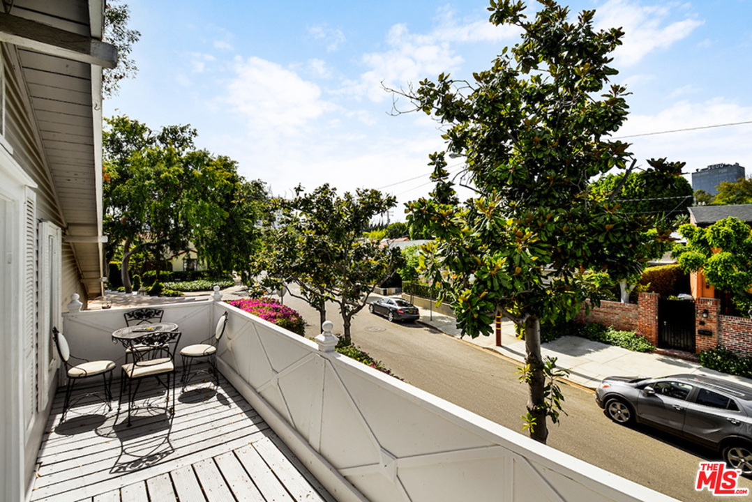 8954 1/2 Norma Place West Hollywood, CA 90069 - Photo 11 of 14 a view of a terrace with furniture and a yard