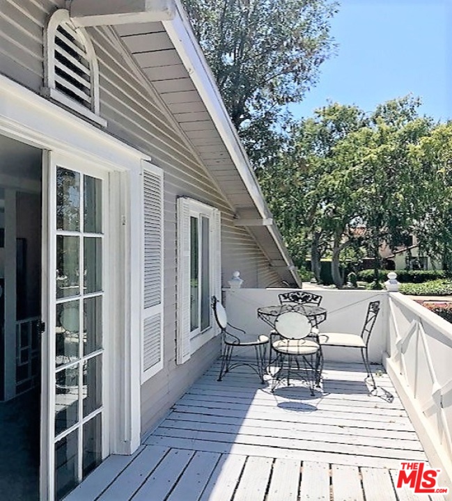 8954 1/2 Norma Place West Hollywood, CA 90069 - Photo 13 of 14 a view of deck with chairs and wooden floor