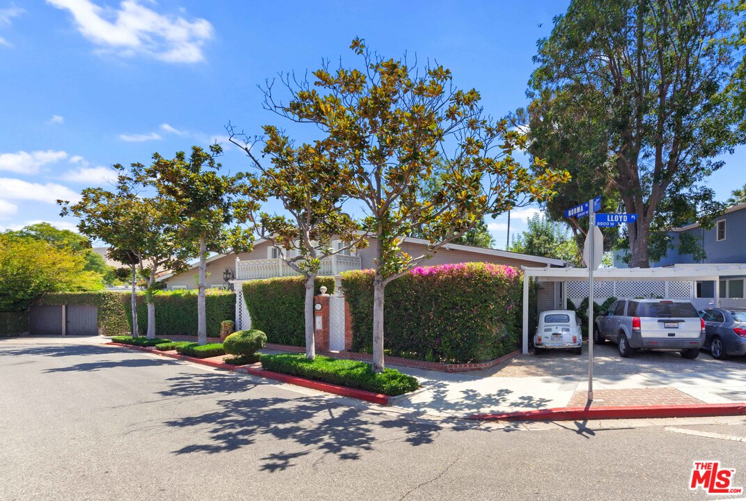 8954 1/2 Norma Place West Hollywood, CA 90069 - Photo 14 of 14 a front view of a house with a yard and garage