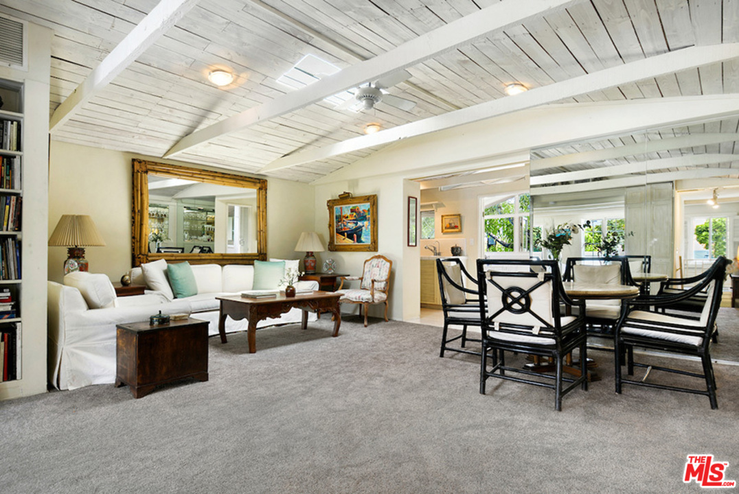8954 1/2 Norma Place West Hollywood, CA 90069 - Photo 3 of 14 a living room with furniture and a large window