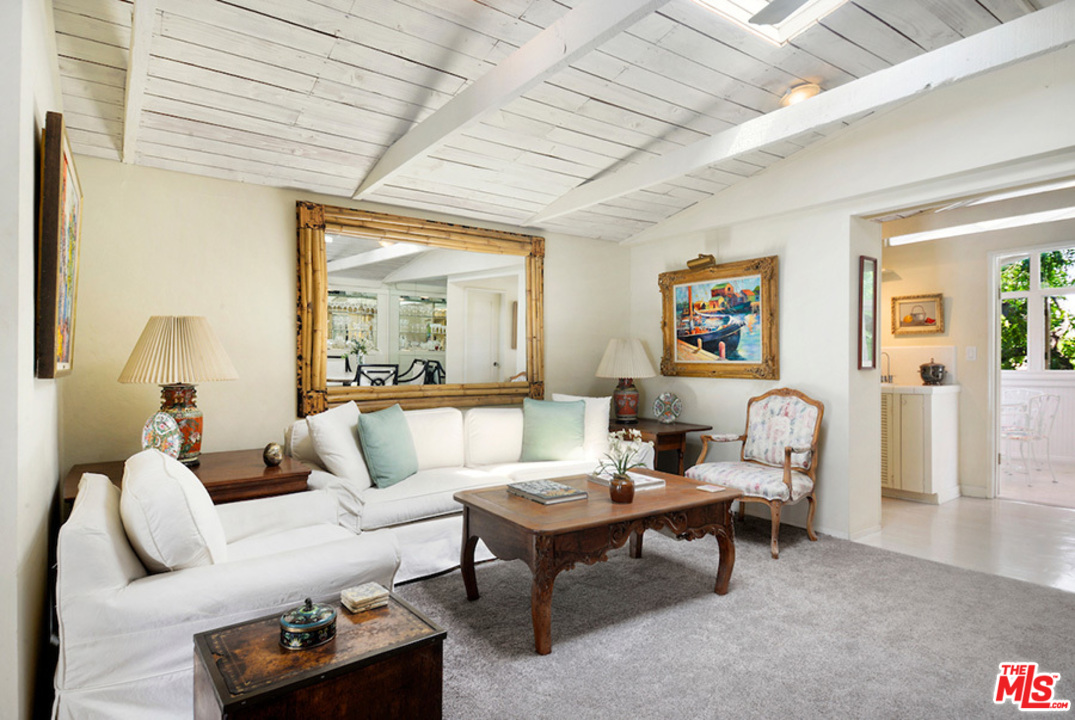 8954 1/2 Norma Place West Hollywood, CA 90069 - Photo 4 of 14 a living room with furniture and a large window