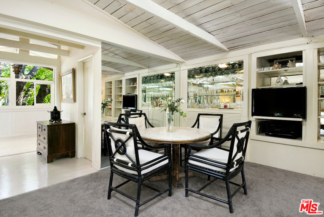 8954 1/2 Norma Place West Hollywood, CA 90069 - Photo 5 of 14 a view of a dining room with furniture and a window