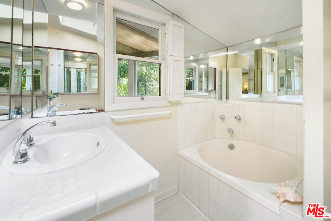 8954 1/2 Norma Place West Hollywood, CA 90069 - Photo 8 of 14 a bathroom with a bathtub and a sink