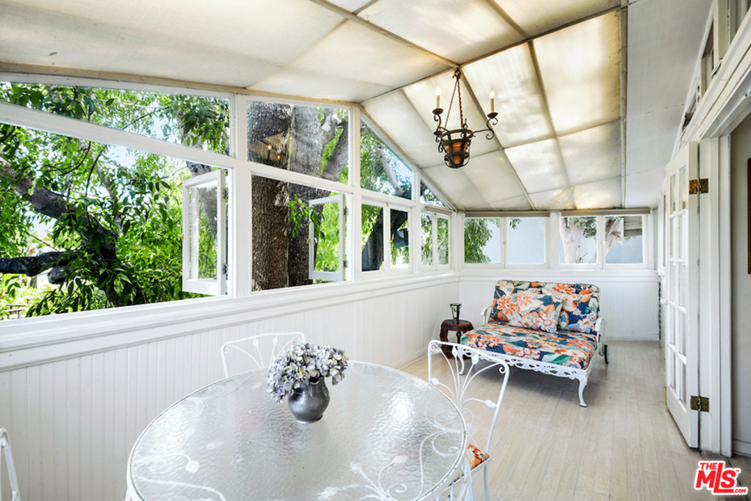 8954 1/2 Norma Place West Hollywood, CA 90069 - Photo 10 of 14 a living room with furniture and a table