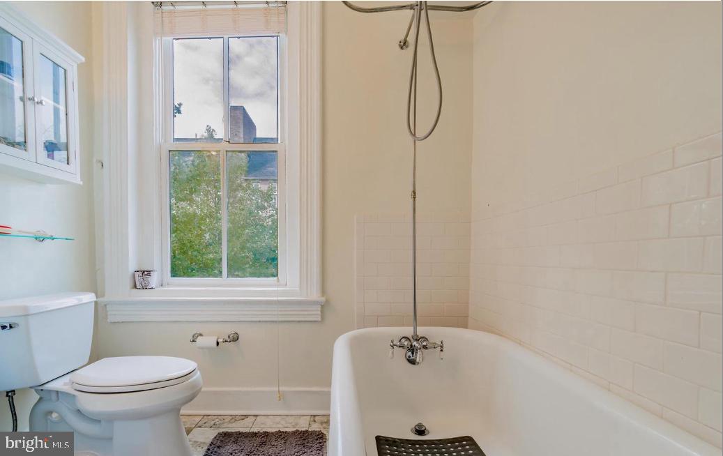 1133 D Street Northeast, Unit 2A Washington, DC 20002 - Photo 11 of 14 a bathroom with a bathtub and a toilet