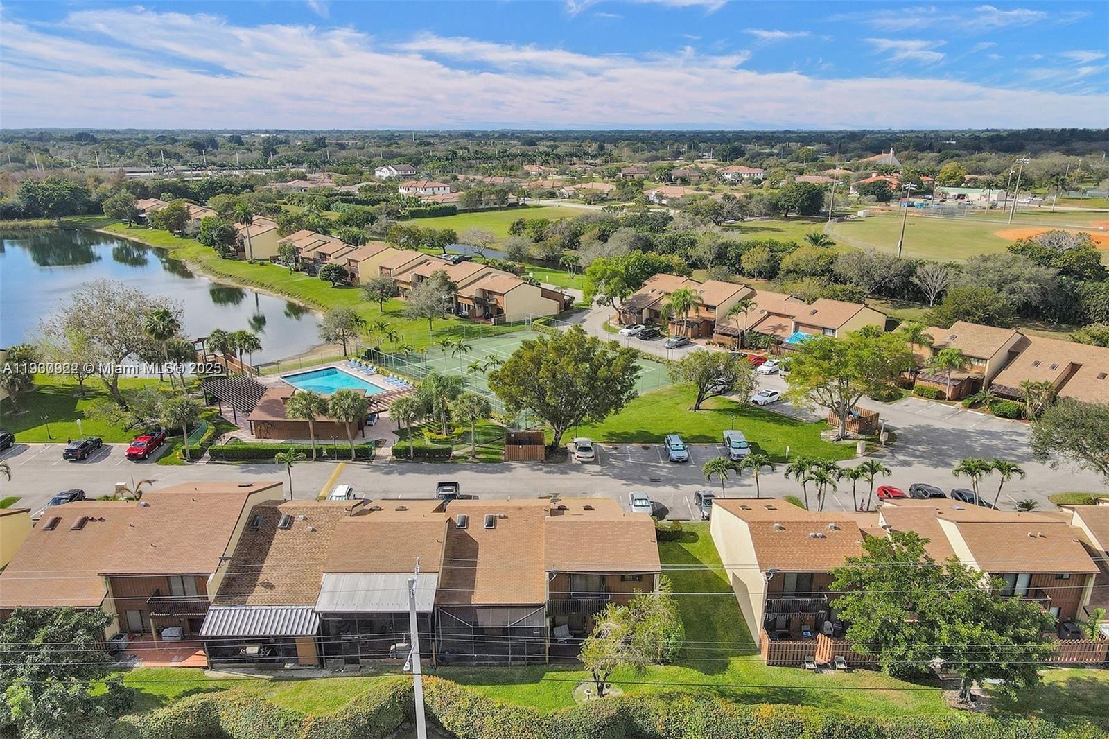 an aerial view of residential houses with outdoor space