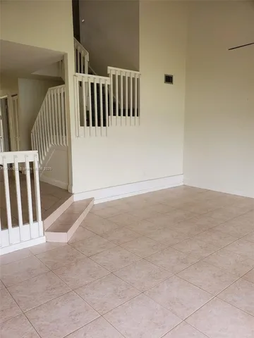 a view of staircase with white walls