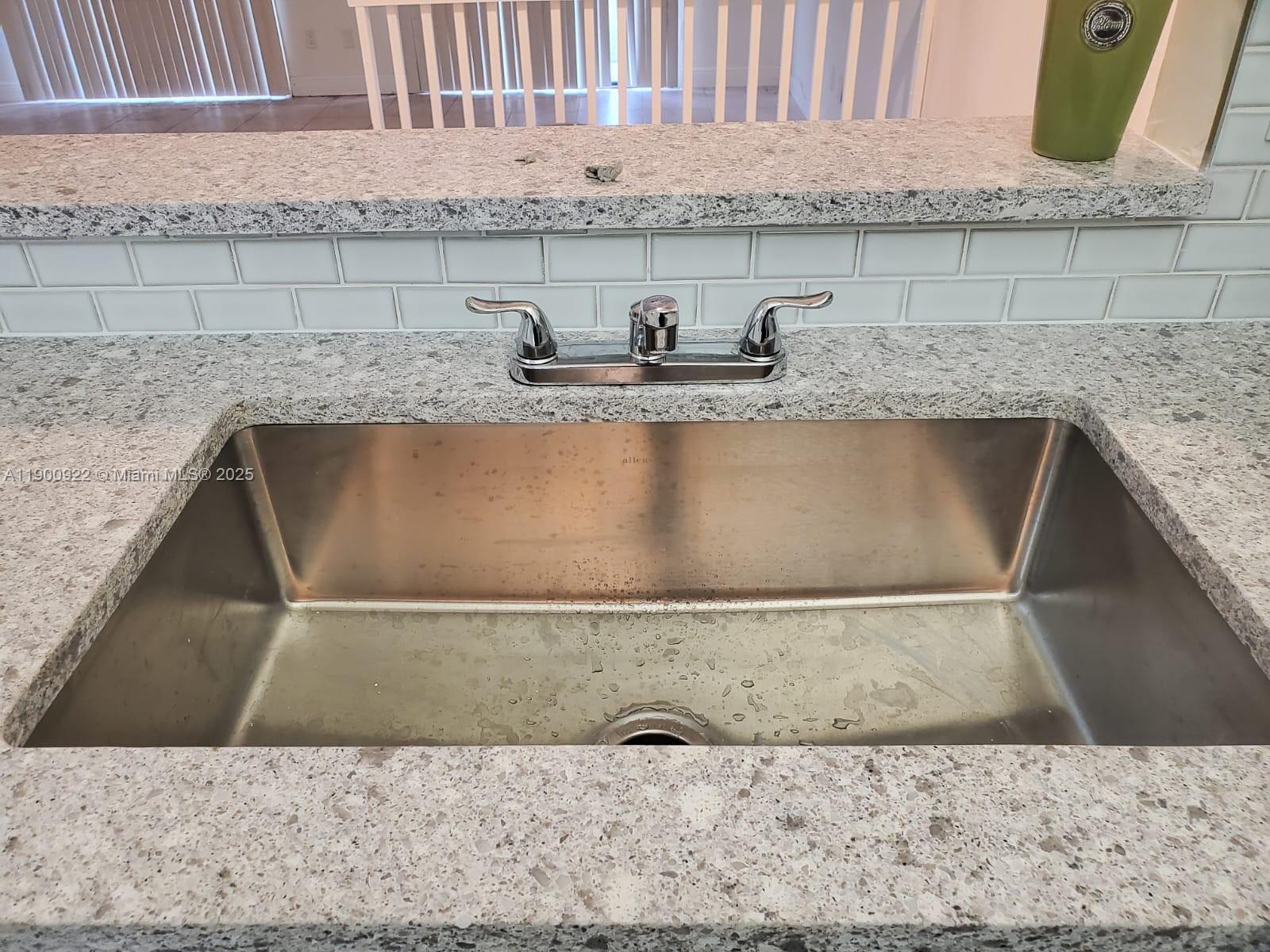 4206 Southwest 87th Terrace, Unit 4206 Davie, FL 33328 - Photo 2 of 37 a close view of sink and cabinets