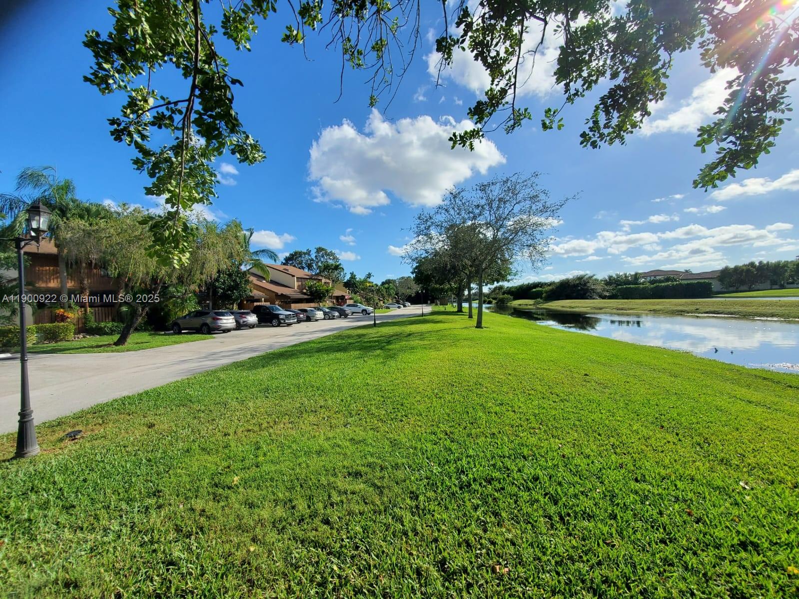 4206 Southwest 87th Terrace, Unit 4206 Davie, FL 33328 - Photo 30 of 37 a view of a golf course with a lake