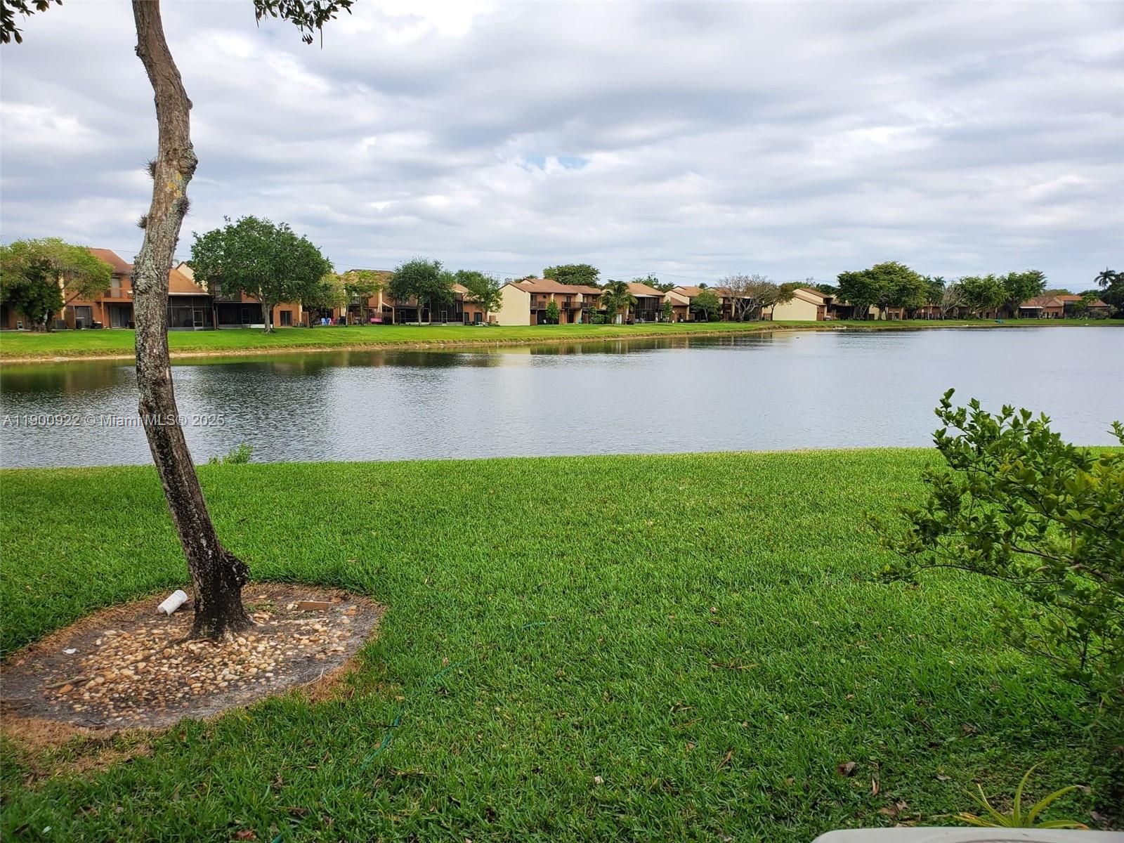 4206 Southwest 87th Terrace, Unit 4206 Davie, FL 33328 - Photo 36 of 37 a view of a lake with houses in the back