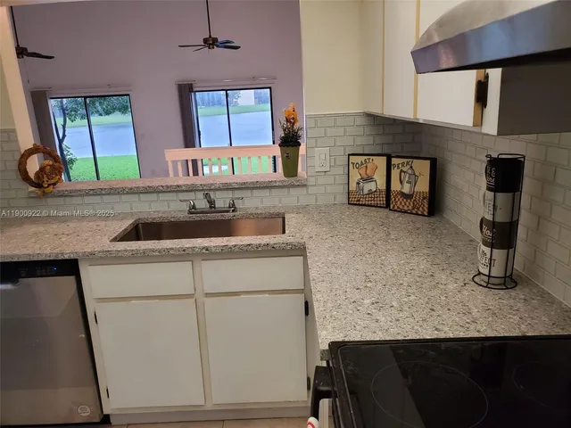 a kitchen with sink and window