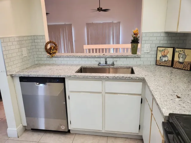 a kitchen with a sink and a cabinets
