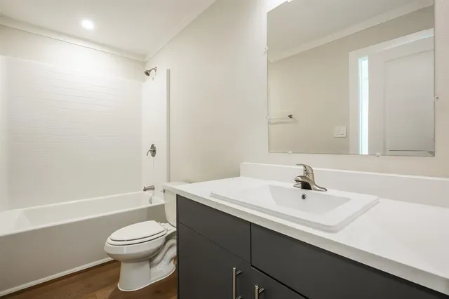 a bathroom with a sink a toilet and a bathtub