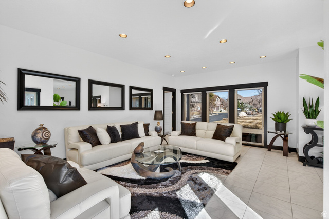 145 Carnesecca Court Mapleton, UT 84664 - Photo 11 of 109 Living area with recessed lighting and light marble finish flooring