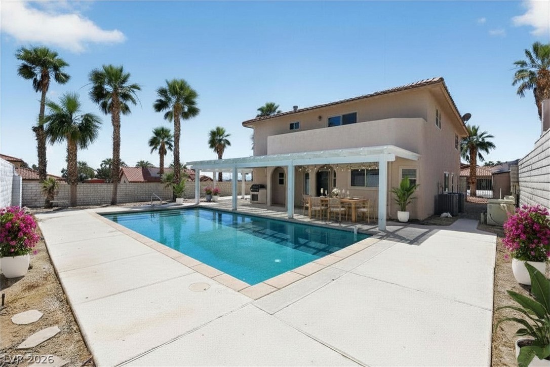 3698 Laughlin Boulevard Laughlin, NV 89029 - Photo 48 of 49 An inviting backyard oasis offers a sparkling pool and a covered patio for outdoor entertaining.