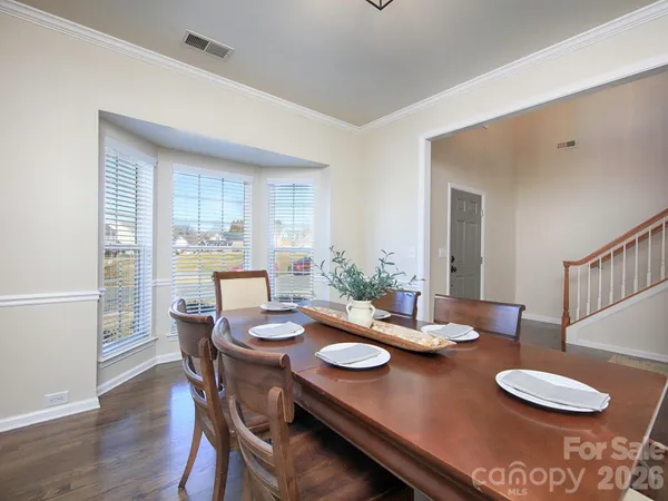 a kitchen with stainless steel appliances granite countertop a refrigerator stove top oven and sink