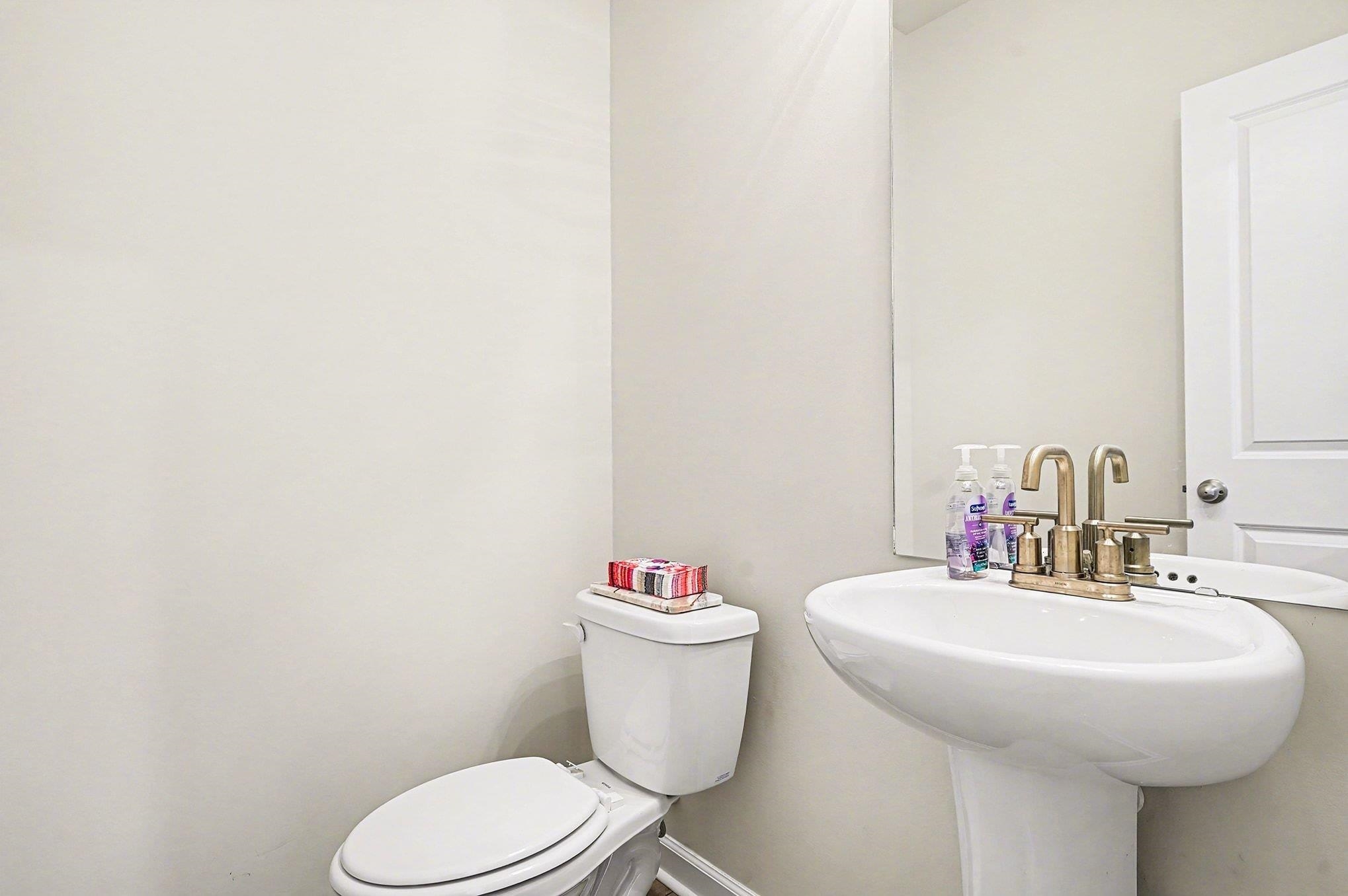 3005 Palma Way Myrtle Beach, SC 29579 - Photo 11 of 30 Half bath featuring toilet and baseboards