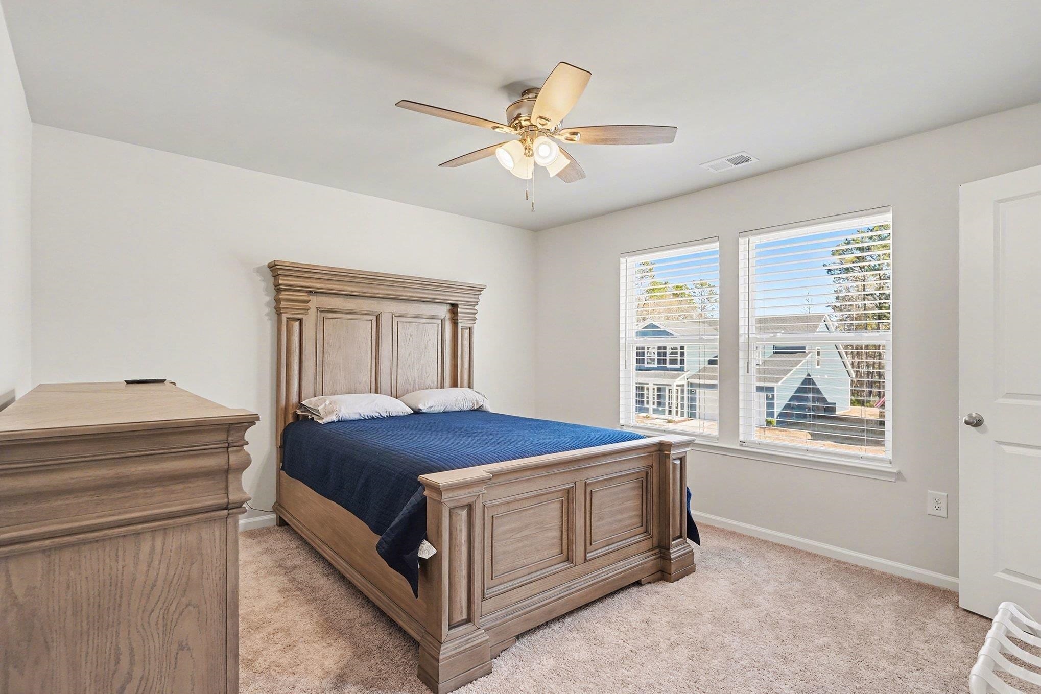 3005 Palma Way Myrtle Beach, SC 29579 - Photo 19 of 30 Bedroom with light carpet and a ceiling fan