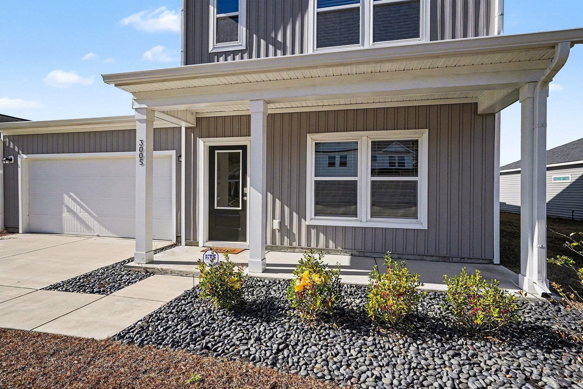 3005 Palma Way Myrtle Beach, SC 29579 - Photo 2 of 30 Doorway to property featuring a porch, driveway, and a garage