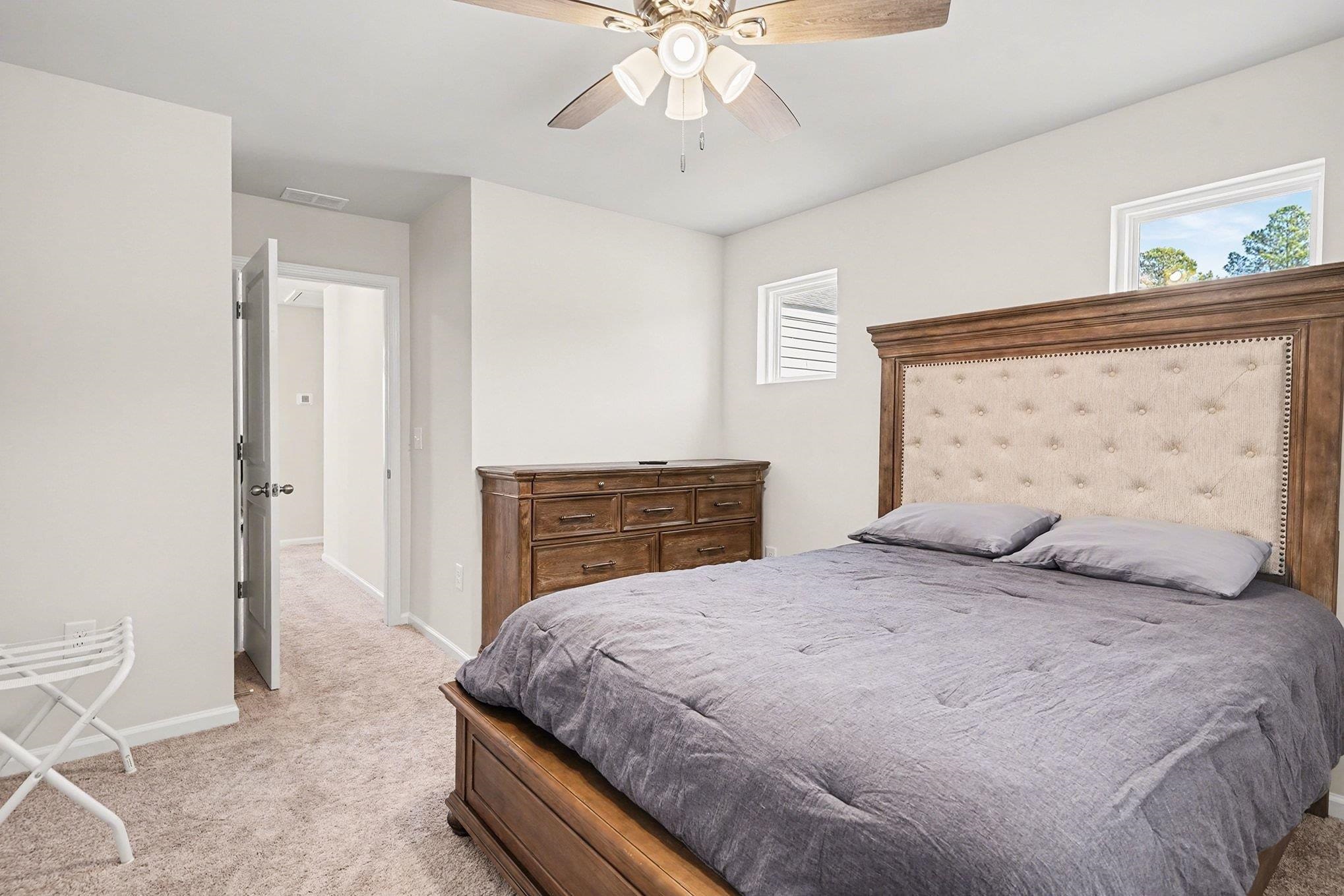 3005 Palma Way Myrtle Beach, SC 29579 - Photo 22 of 30 Bedroom featuring multiple windows, light carpet, and a ceiling fan
