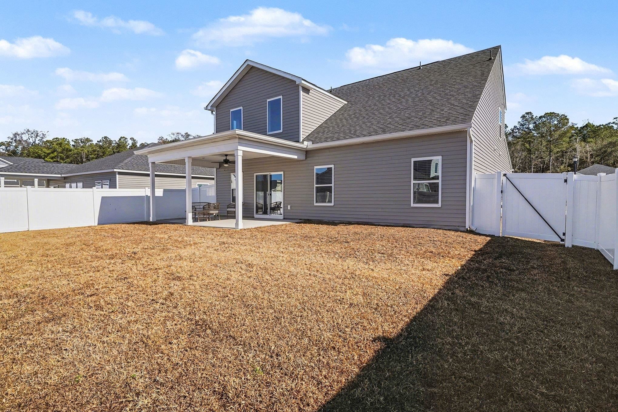 3005 Palma Way Myrtle Beach, SC 29579 - Photo 26 of 30 Rear view of property with a gate, a patio area, ceiling fan, and a fenced backyard
