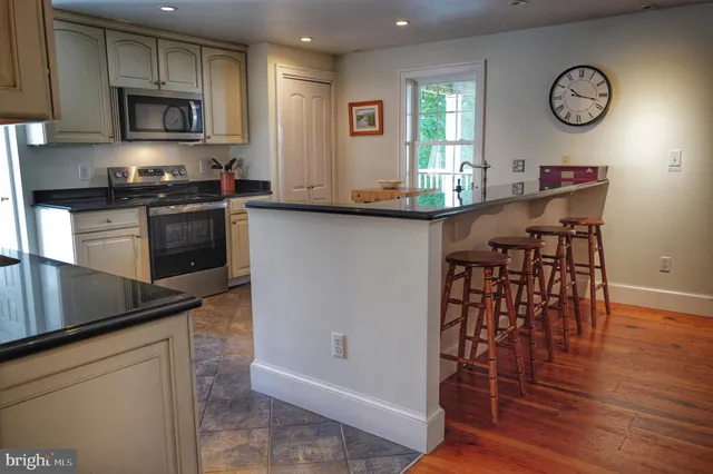 a white toilet sitting next to a bathroom sink