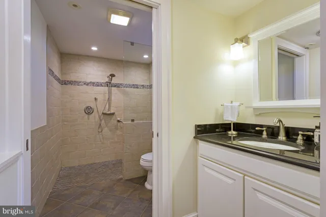 a bathroom with a toilet and shower