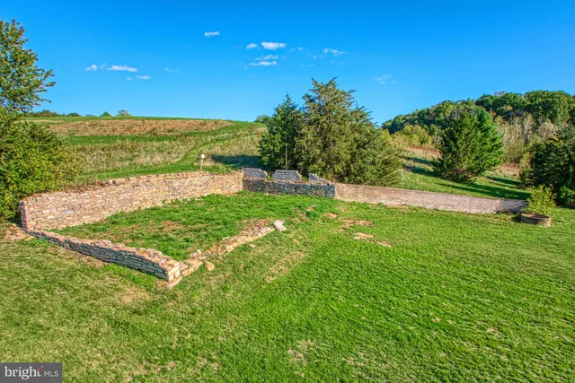 a bedroom with a bed and a book shelf