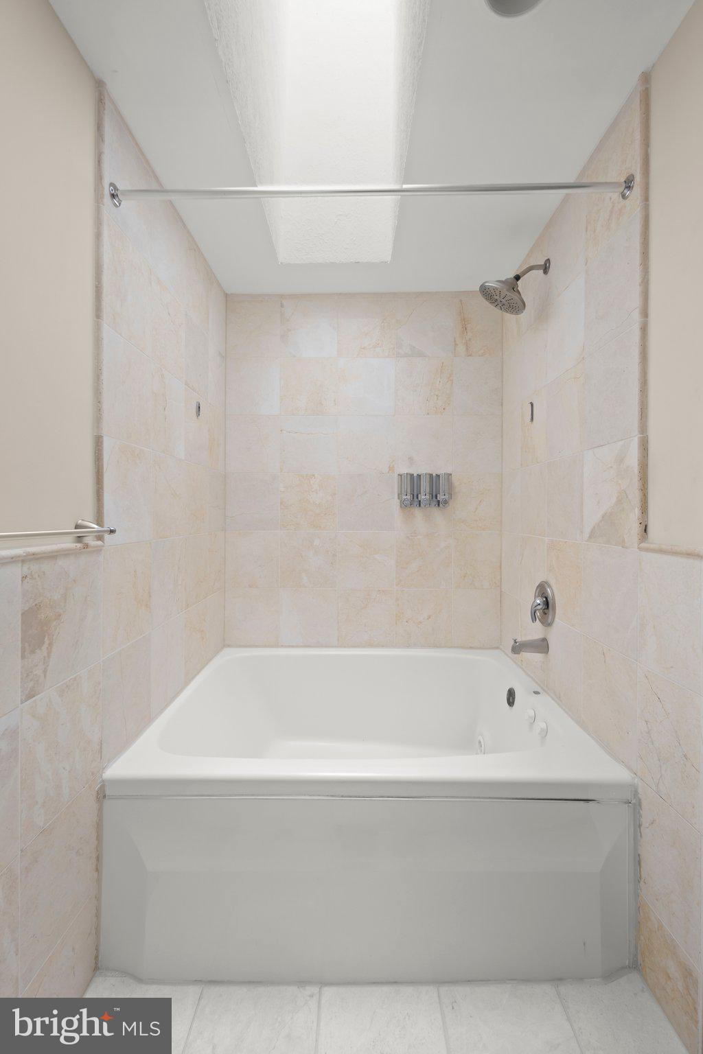 1451 Bluemont Court Herndon, VA 20170 - Photo 19 of 33 a bathroom with a bathtub and a shower