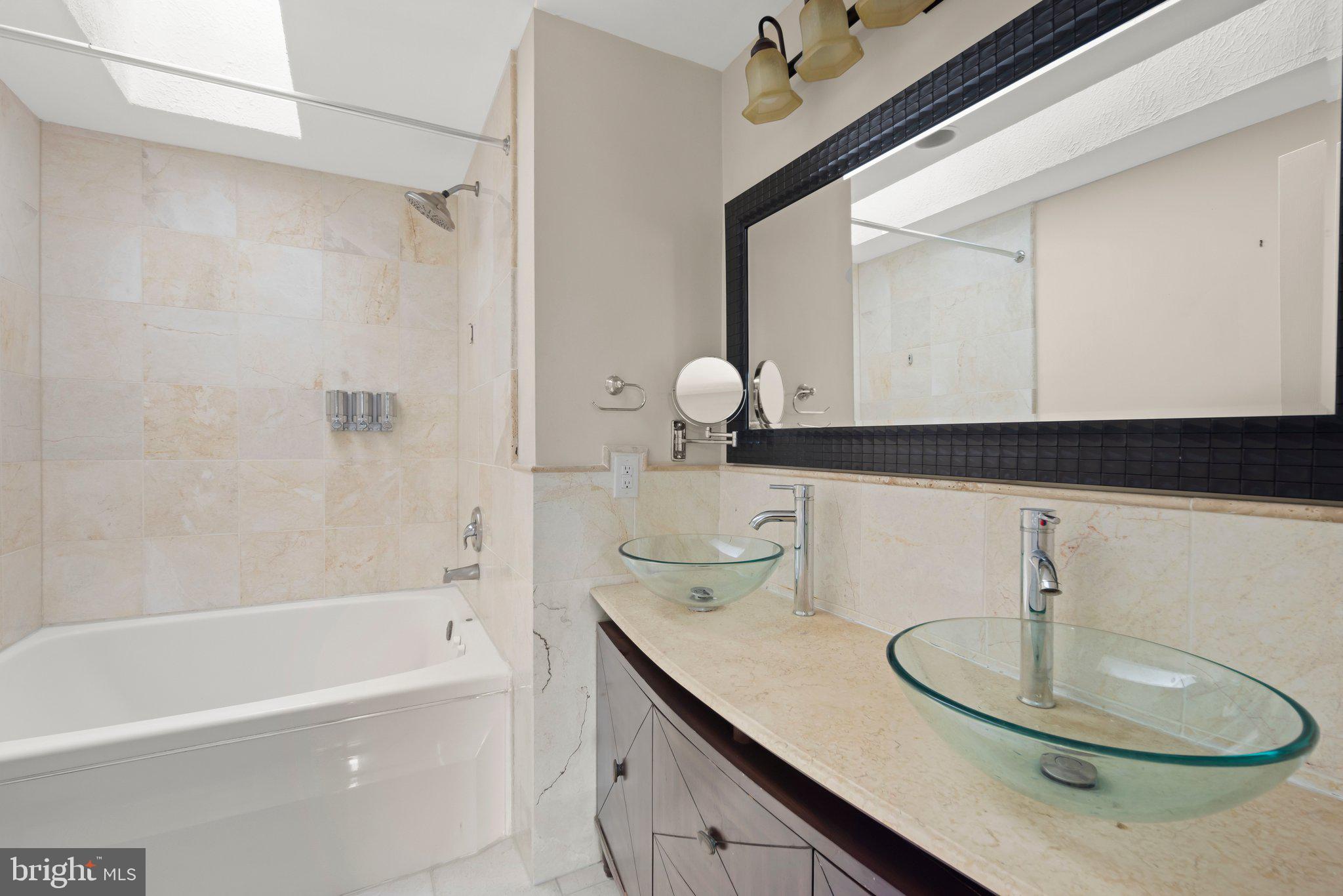 1451 Bluemont Court Herndon, VA 20170 - Photo 20 of 33 a bathroom with a sink and a mirror