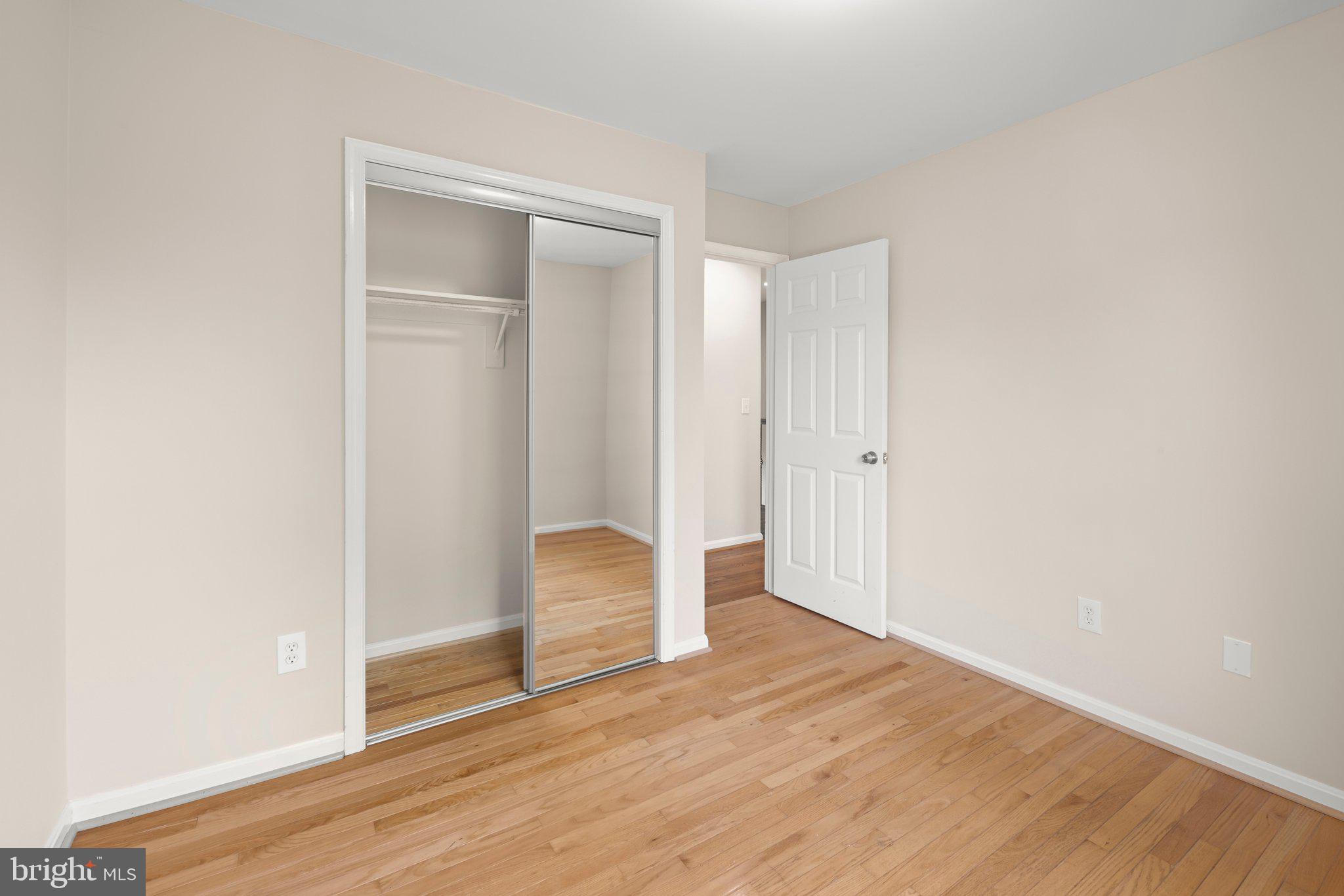1451 Bluemont Court Herndon, VA 20170 - Photo 21 of 33 an empty room with wooden floor and closet
