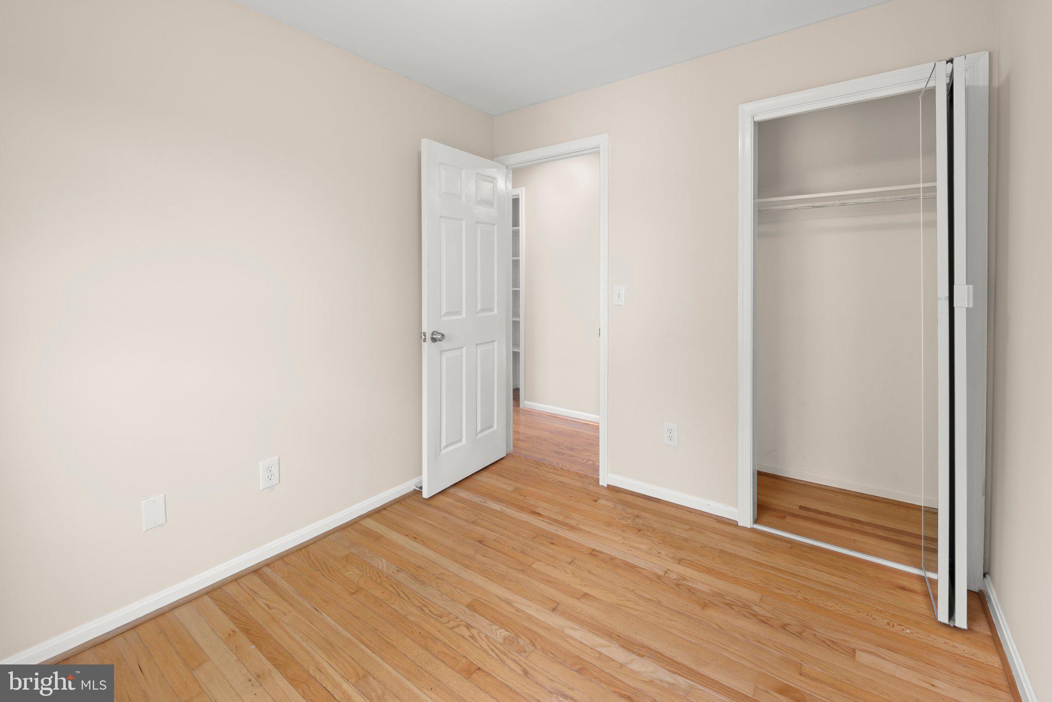 1451 Bluemont Court Herndon, VA 20170 - Photo 24 of 33 a view of an empty room with wooden floor and closet