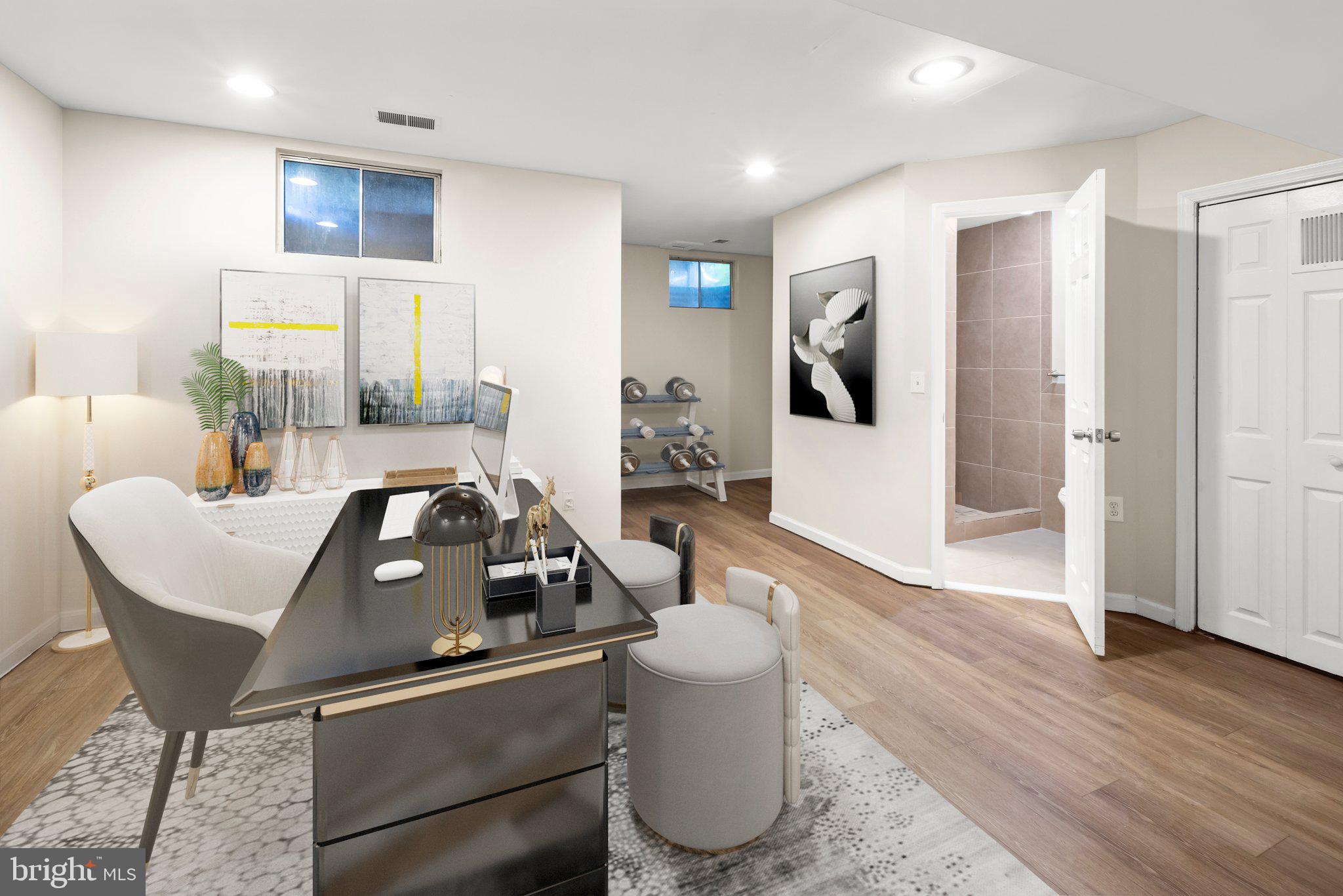 1451 Bluemont Court Herndon, VA 20170 - Photo 26 of 33 a room with furniture and wooden floor