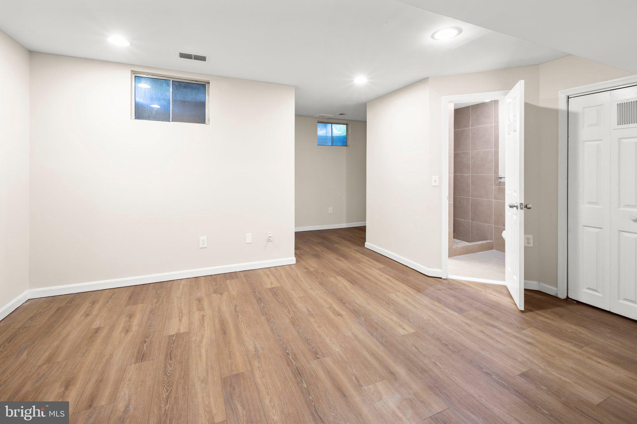 1451 Bluemont Court Herndon, VA 20170 - Photo 27 of 33 a view of an empty room with wooden floor