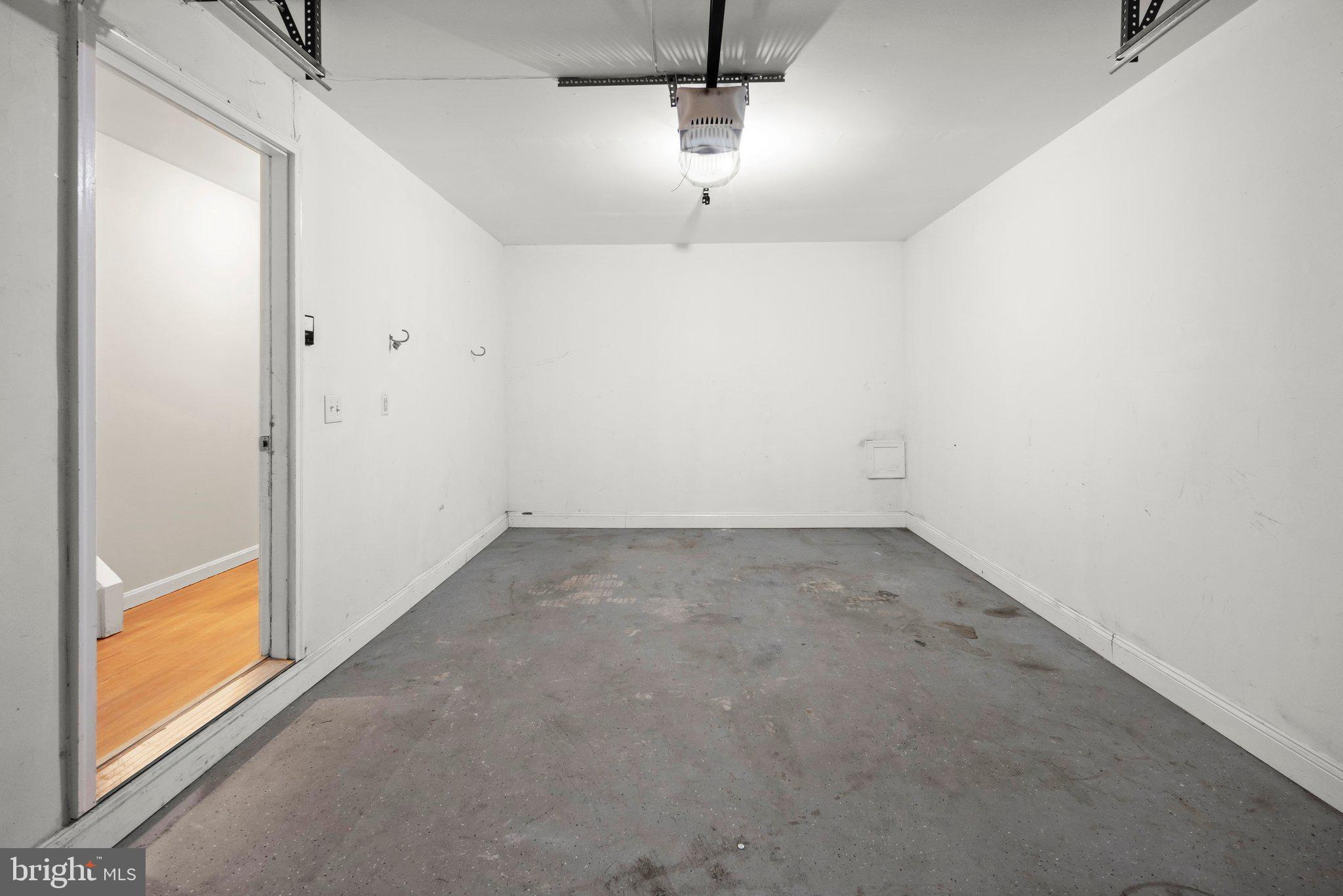 1451 Bluemont Court Herndon, VA 20170 - Photo 30 of 33 an empty room with a chandelier fan and windows