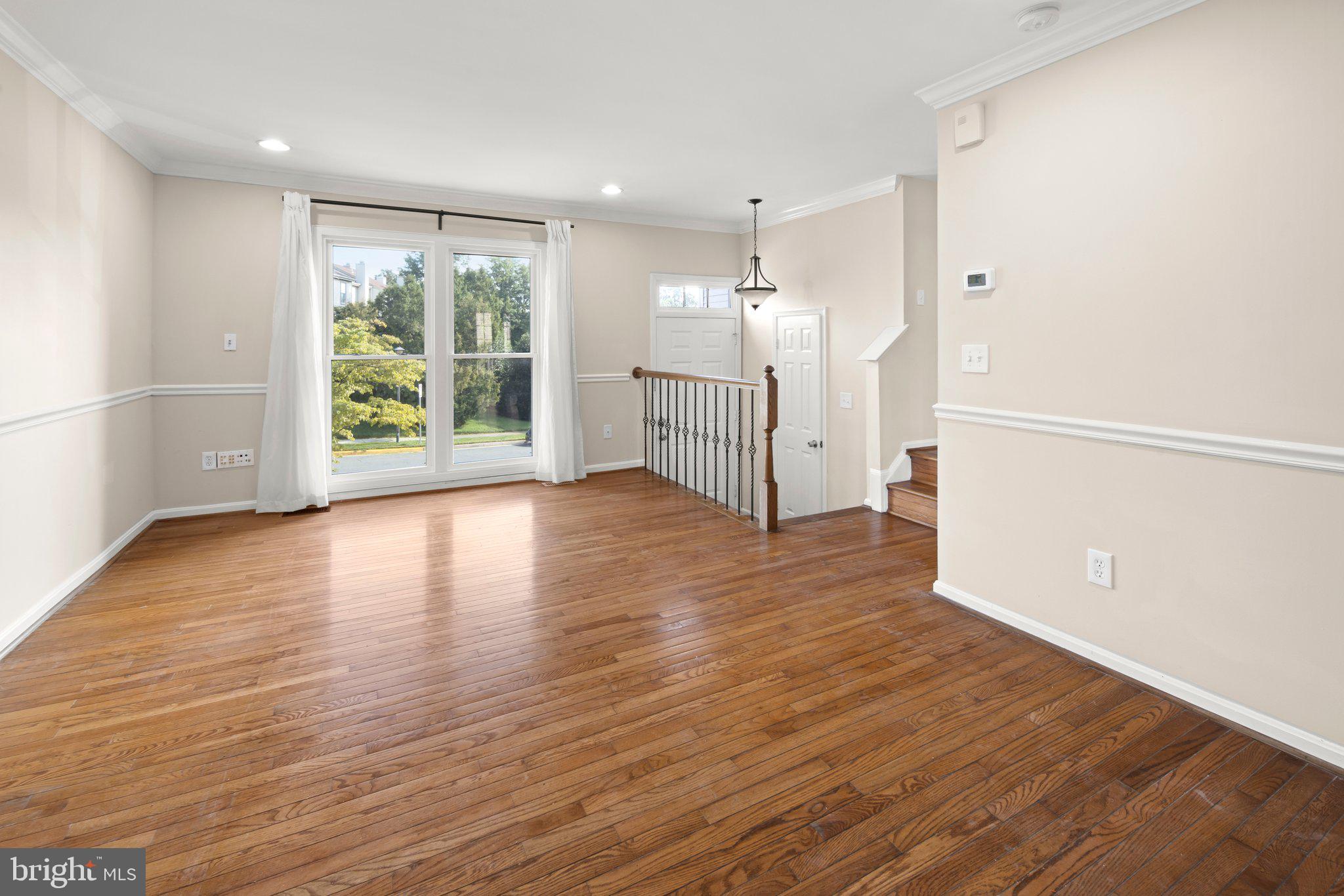 1451 Bluemont Court Herndon, VA 20170 - Photo 5 of 33 an empty room with wooden floor and windows
