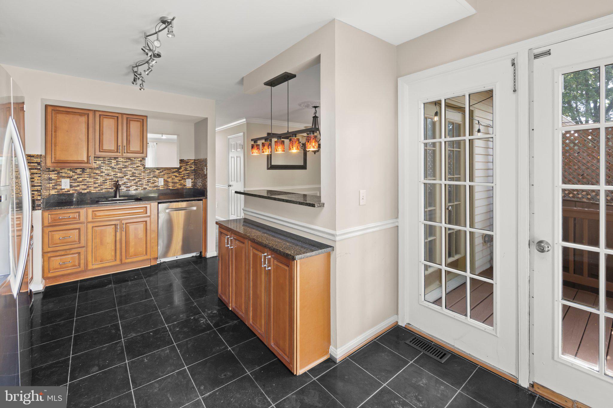 1451 Bluemont Court Herndon, VA 20170 - Photo 10 of 33 a kitchen with stainless steel appliances a sink and cabinets