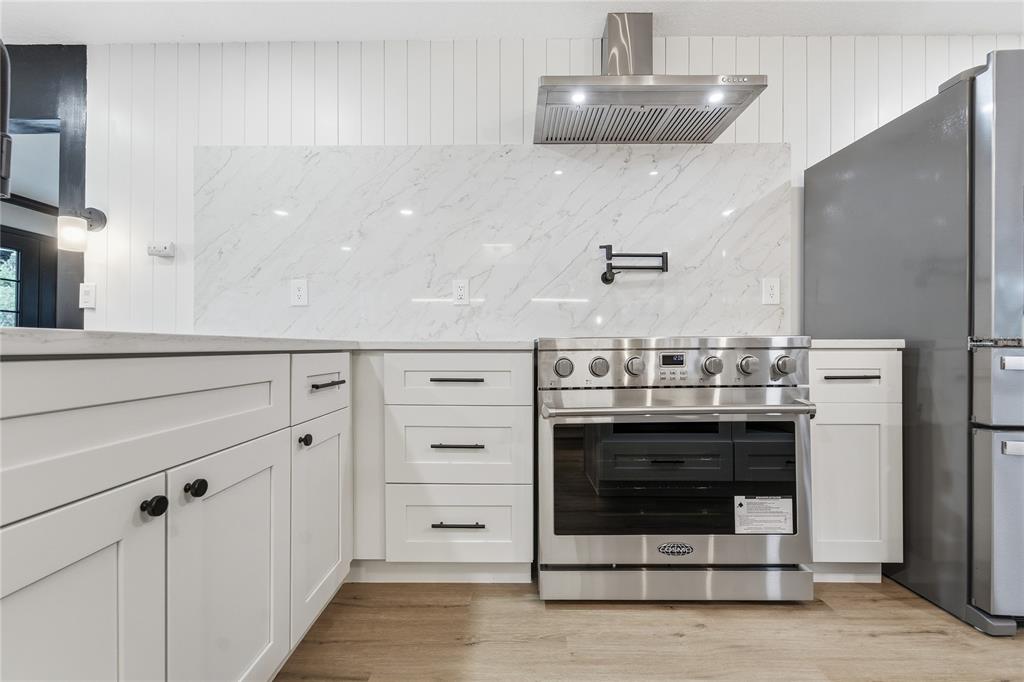 14728 Henson Road Orlando, FL 32832 - Photo 60 of 79 a stove top oven sitting inside of a kitchen